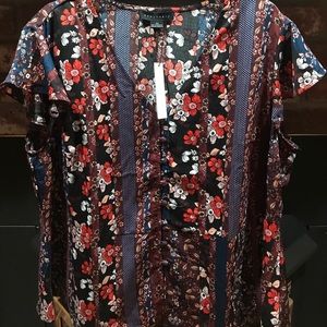 100% polyester floral print button up blouse.